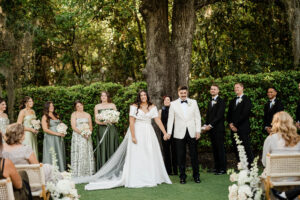 Wedding officiant Sherri smiling warmly while leading an intentional wedding ceremony in Wilmington, NC.